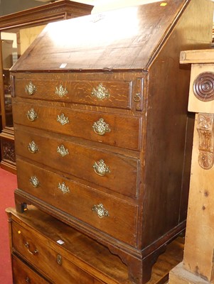 Lot 1386 - A circa 1800 provincial oak slopefront four...