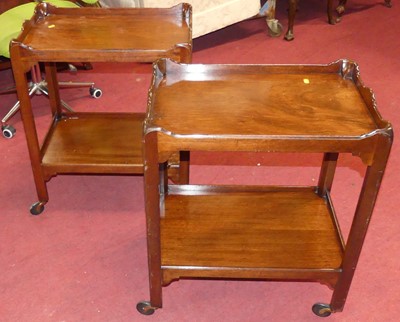 Lot 1388 - A pair of mahogany two-tier tea trolleys, on...