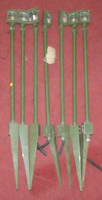 Lot 1396 - A set of seven green enamelled metal...