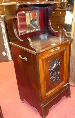 Lot 1403 - An Edwardian walnut coal purdonium, having...