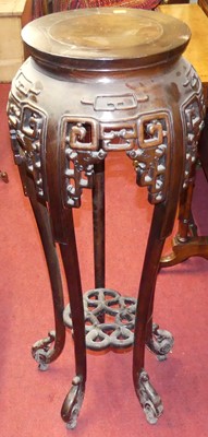 Lot 1426 - A contemporary Chinese hardwood circular urn...