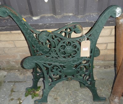 Lot 1438 - A pair of floral pierced cast iron and green...