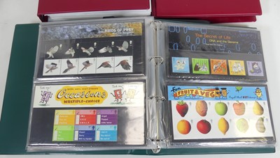 Lot 397 - Four albums of mint presentation packs, to...