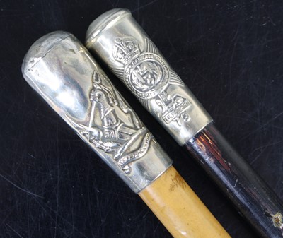 Lot 711 - A swagger stick, having an ebonised shaft and...