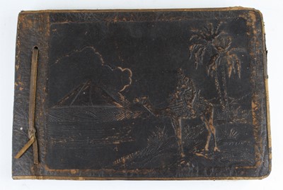 Lot 641 - A WW II period photograph album, the opening...