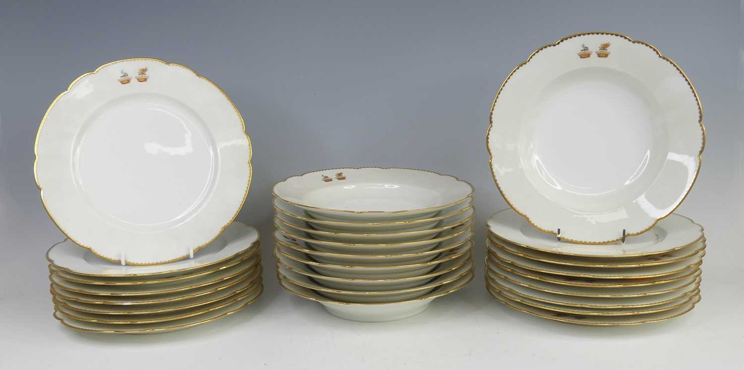 Lot 2039 - A French armorial porcelain part dinner...