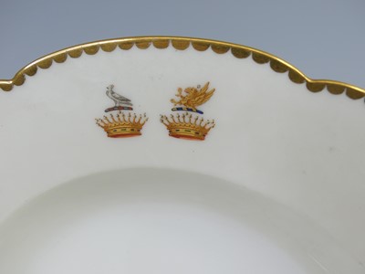 Lot 2039 - A French armorial porcelain part dinner...