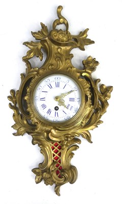 Lot 2461 - A Rococo Revival gilt brass cartel clock,...
