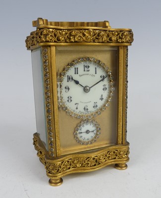 Lot 2460 - A circa 1900 lacquered brass carriage clock...