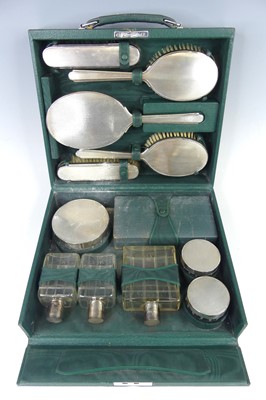 Lot 127 - A late Art Deco silver travelling vanity case...