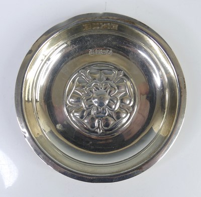 Lot 132 - A 1970s silver circular alms dish, decorated...