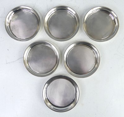 Lot 131 - A set of six Art Deco silver coasters, each...