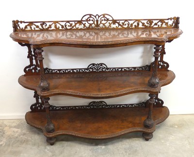 Lot 2489 - A Victorian figured walnut three-tier buffet...