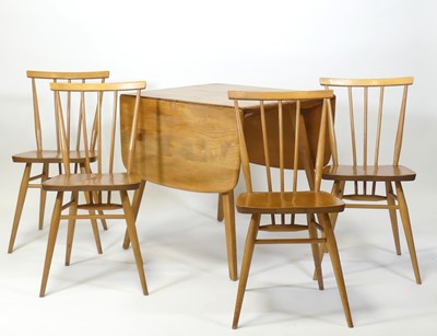 Lot 376 - A 1960s Ercol blond elm and beech dining suite,...