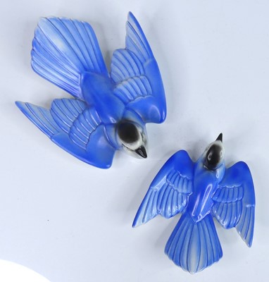 Lot 33 - Two Poole Pottery bluebird wall plaques, each...