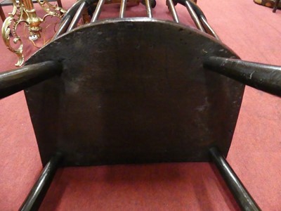 Lot 2505 - An 18th century oak seat and ash comb-back...