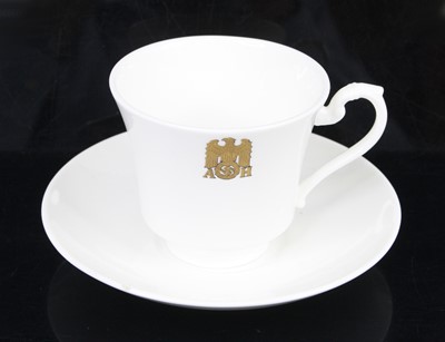 Lot 589 - A pair of Allach teacups and saucers, each on...