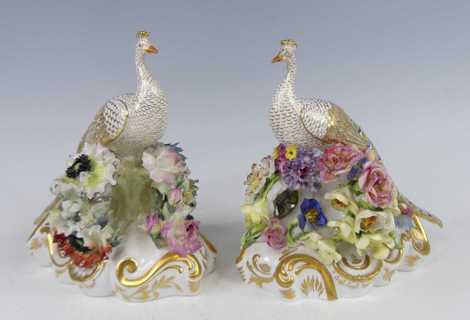 Lot 2044 - A pair of Royal Crown Derby porcelain peacocks,...