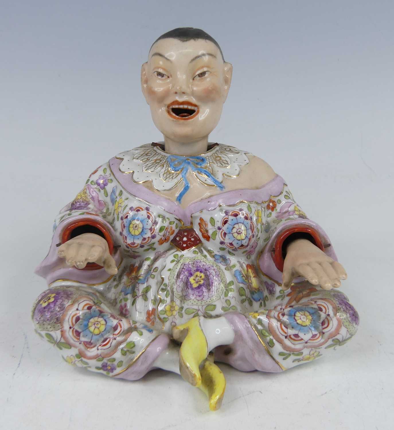 Lot 2048 - A circa 1900 continental porcelain nodding...