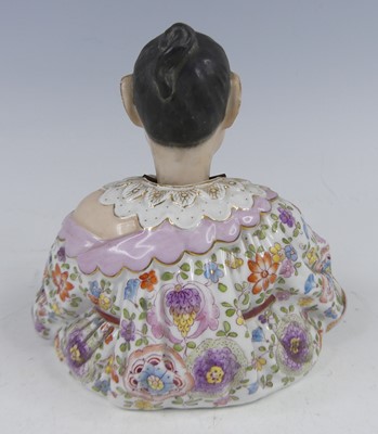 Lot 2048 - A circa 1900 continental porcelain nodding...