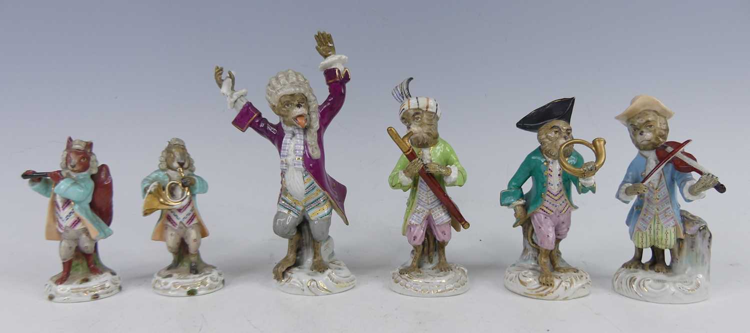 Lot 2045 - A continental porcelain harlequin monkey band...