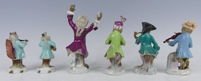 Lot 2045 - A continental porcelain harlequin monkey band...