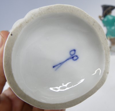 Lot 2045 - A continental porcelain harlequin monkey band...