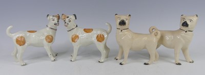 Lot 2043 - A pair of Staffordshire pug dogs, each with...