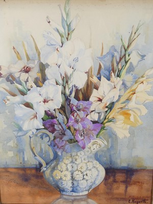Lot 1006 - E Hogarth (20th Century) Gladiolus in a blue...