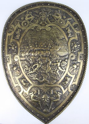 Lot 798 - A large decorative brass shield, after the...