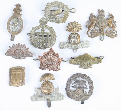 Lot 669 - A collection of cap badges to include The...
