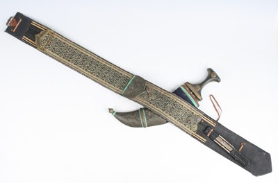 Lot 784 - An early 20th century Omani jambiya, having a...