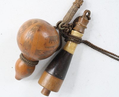 Lot 923 - A late 19th century double gourd powder flask,...