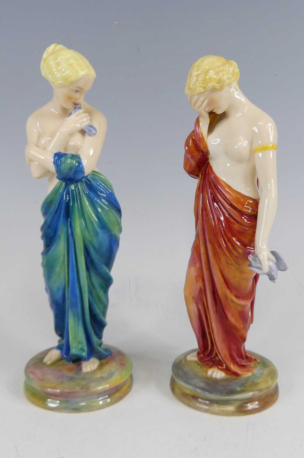 Lot 2049 - A pair of Royal Worcester porcelain figures...