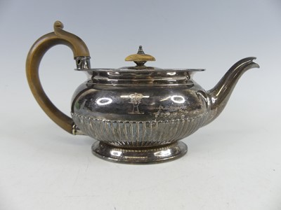 Lot 2248 - A George IV silver teapot of half reeded oval...