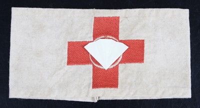 Lot 785 - A German Red Cross armband, in cream cotton...
