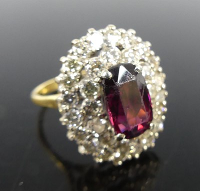 Lot 2299 - A yellow and white metal garnet and diamond...