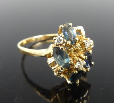 Lot 2267 - A yellow metal sapphire and diamond abstract...