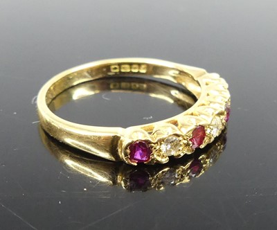 Lot 2297 - An 18ct yellow gold ruby and diamond half...