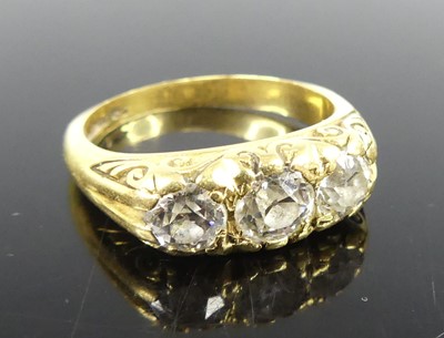 Lot 2281 - An 18ct yellow gold diamond three stone ring...