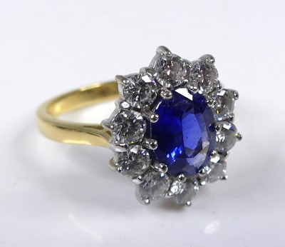 Lot 2270 - An 18ct yellow and white gold sapphire and...
