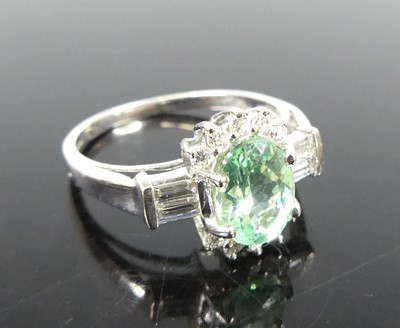 Lot 2291 - An 18ct white gold tourmaline and diamond oval...