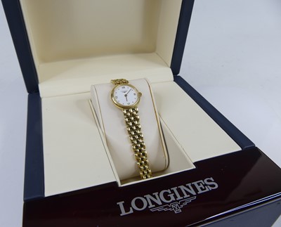 Lot 2306 - A lady's Longines 18ct gold cased quartz...