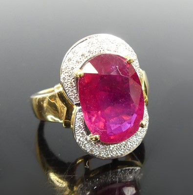 Lot 2298 - An 18ct yellow gold synthetic ruby and diamond...