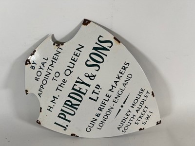 Lot 907 - An enamel advertising sign of shield shape for...