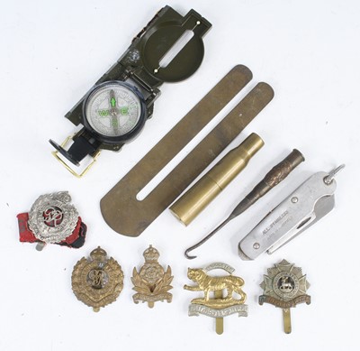 Lot 630 - A small collection of cap badges to include...