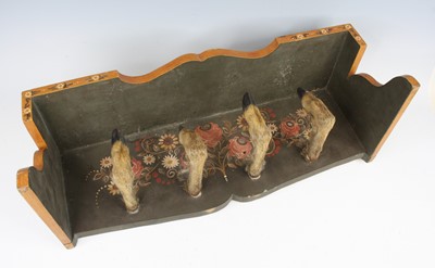 Lot 958 - A wall mounted taxidermy coat hook, the four...