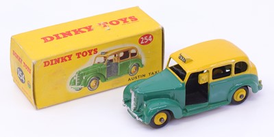 Lot 1103 - Dinky Toys No. 254 Austin Taxi comprising a...