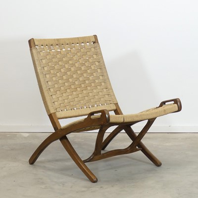 Lot 412 - In the manner of Hans Wegner - a stained beech...