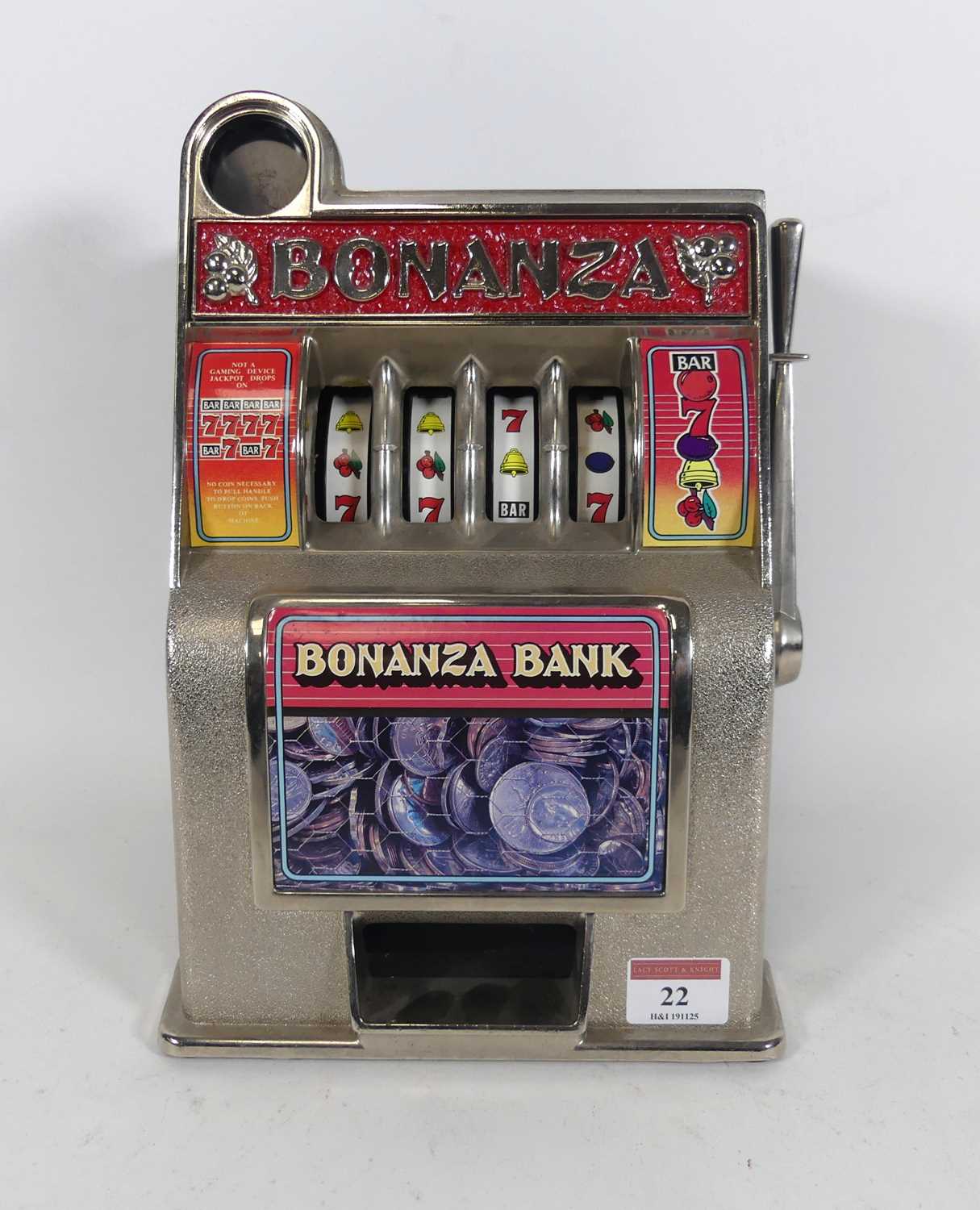 Lot 22 - A reproduction Bonanza slot machine, h. 28cm